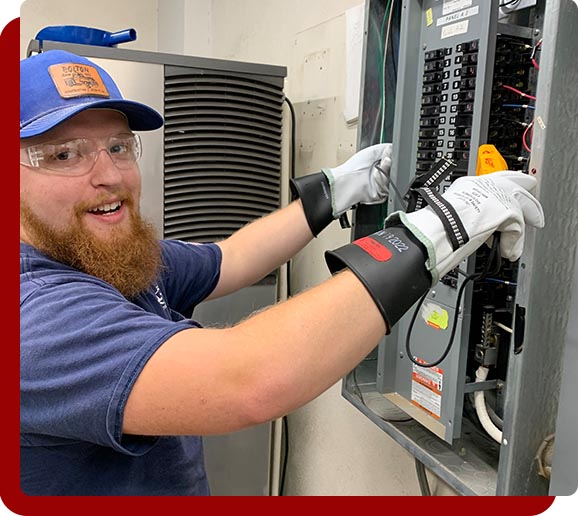 Electrican installing electrical breaker box