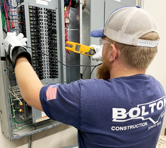 Licensed Commercial Electrician Installing Electrical Panel in Raleigh, NC