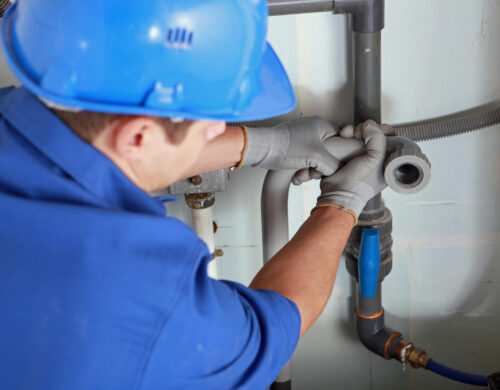 technician performing Tankless Water Heater Installation in Apex, NC