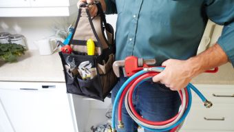 Residential Plumber with tools for a job in Fuquay-Varina, NC 