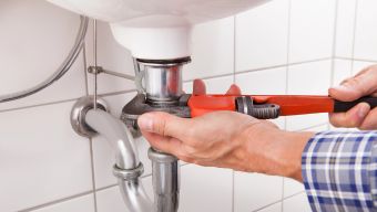 Commercial Plumber working in a Cary, NC Building