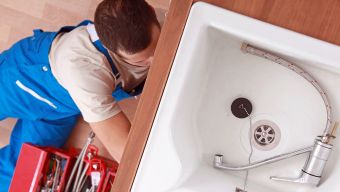 Residential Plumber working in a Cary, NC Home