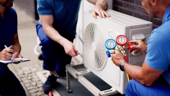 Technicians Performing an Air Conditioning Service in Holly Springs, NC